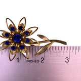 Large Gold Tone Blue Rhinestone Flower Brooch Pin Vintage Pressed Metal Design