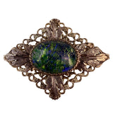 Vintage Unknown Gold-Tone Womens Oval Brooch Dragons Breath Glass Cabochon