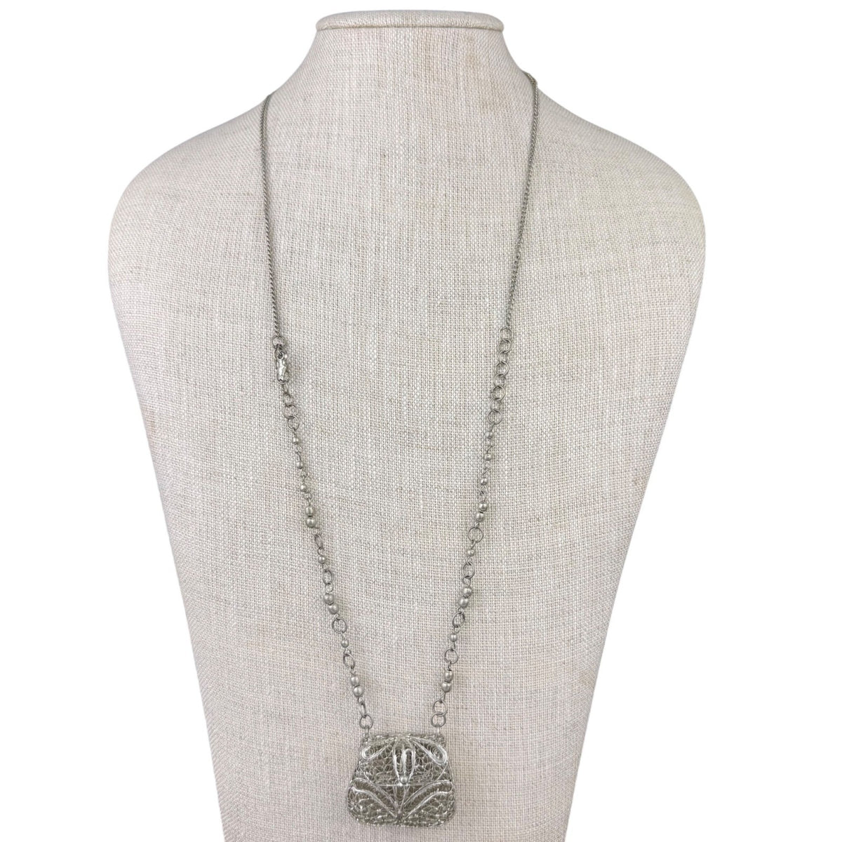 Vintage Silver Tone Metal Pendant Necklace With Ornate Filigree Purse Design