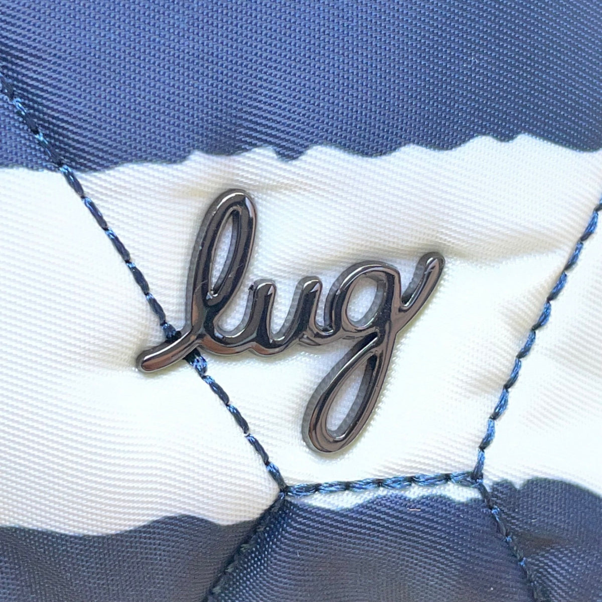Lug Bebop Women’s Navy & White Adjustable Strap Quilted Striped Crossbody Bag