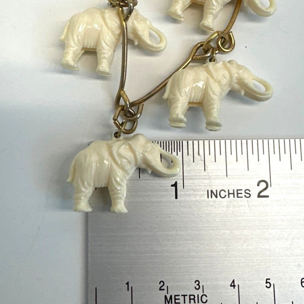20 Herd Celluloid Elephants Dangling from Gold Tone Chain Necklace - 36in