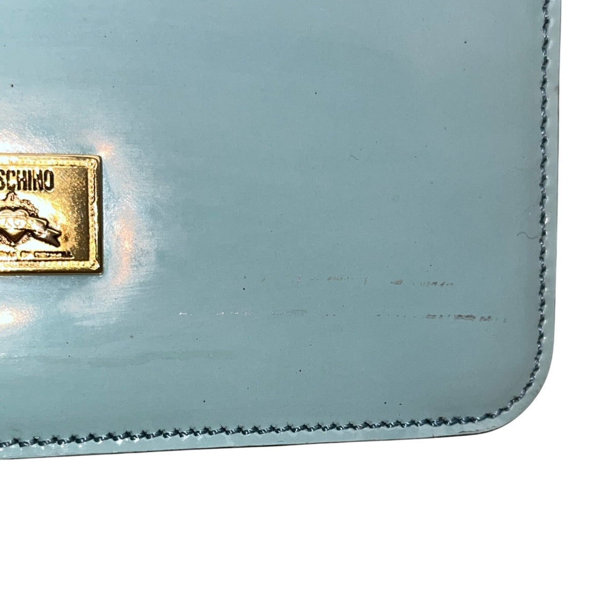 Moschino Women’s Light Blue Leather Gold Logo Hardware Structured Clutch Handbag