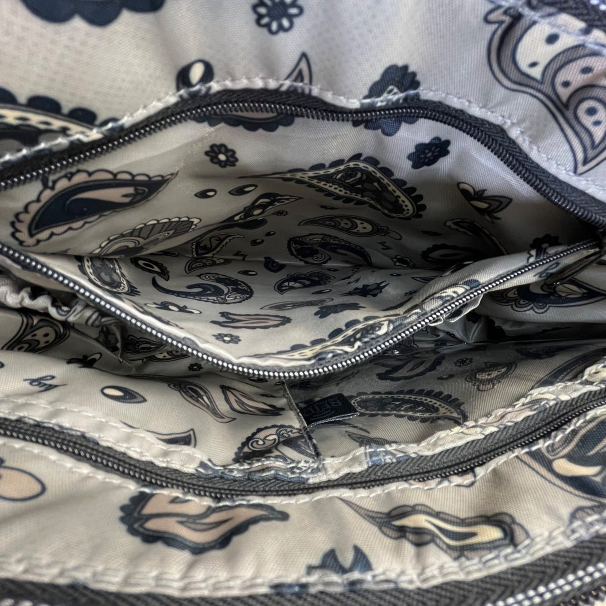 Lug Quilted Black Nylon Adjustable Strap & Zipper Pockets Swivel Crossbody Bag
