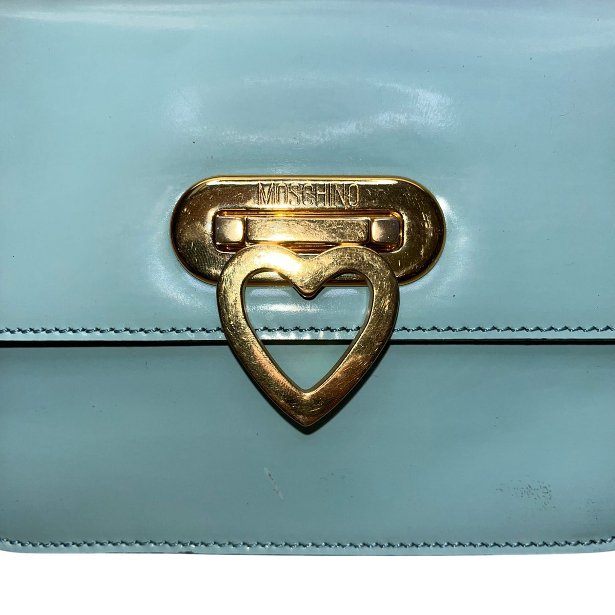 Moschino Women’s Light Blue Leather Gold Logo Hardware Structured Clutch Handbag