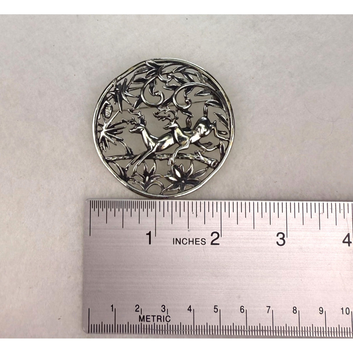 Vintage Sarah Coventry Silver Tone Reindeer Brooch Filigree Design Round Pin