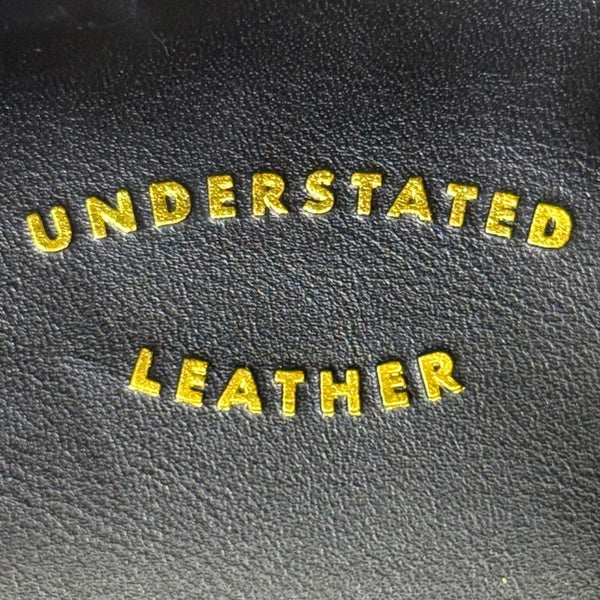 Understated Leather Women’s Black Leather With Tassel Detail & Gold Chain Clutch