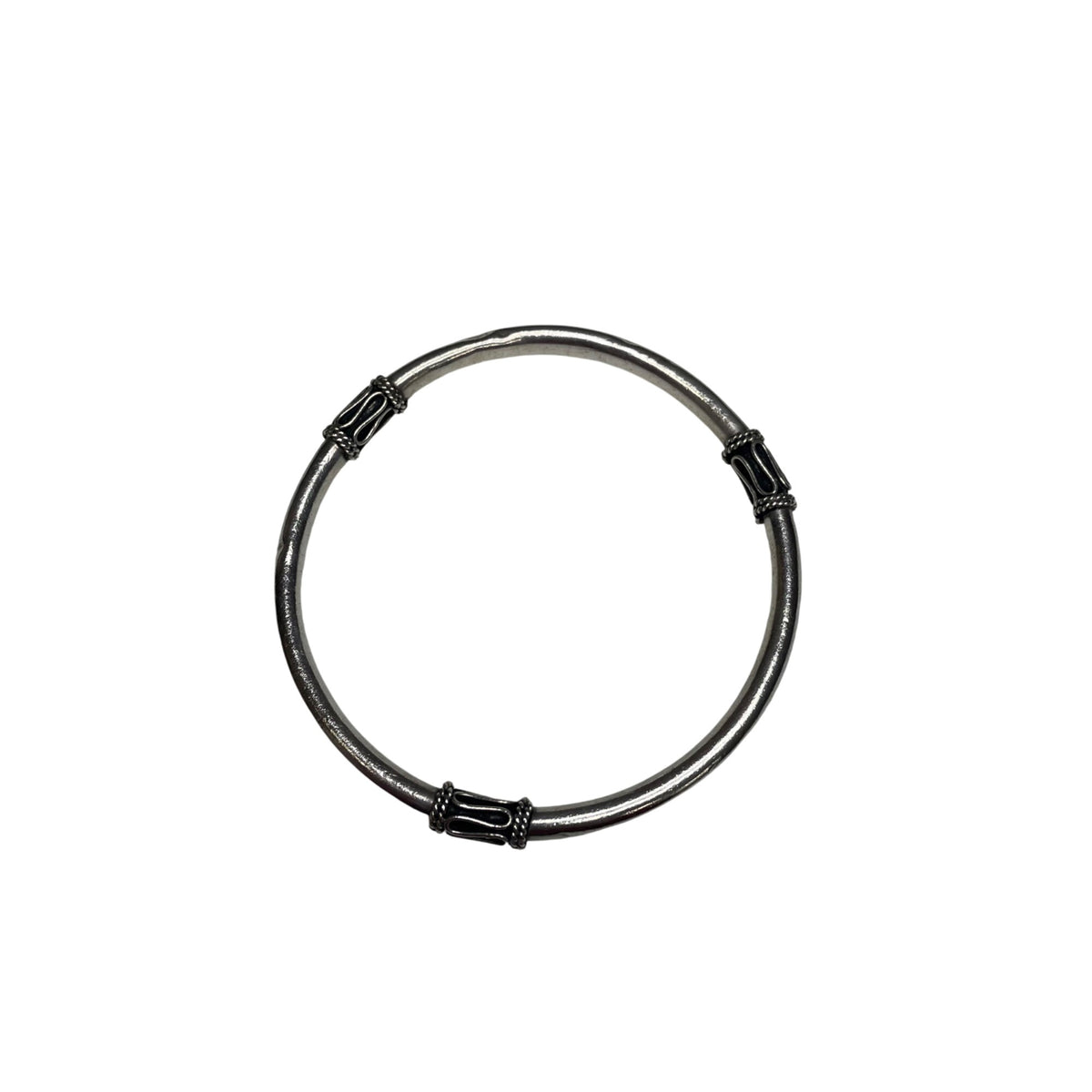 Silver Womans Antiqued Bangle Bracelet With Tribal-Inspired Design Details And Smooth Finish