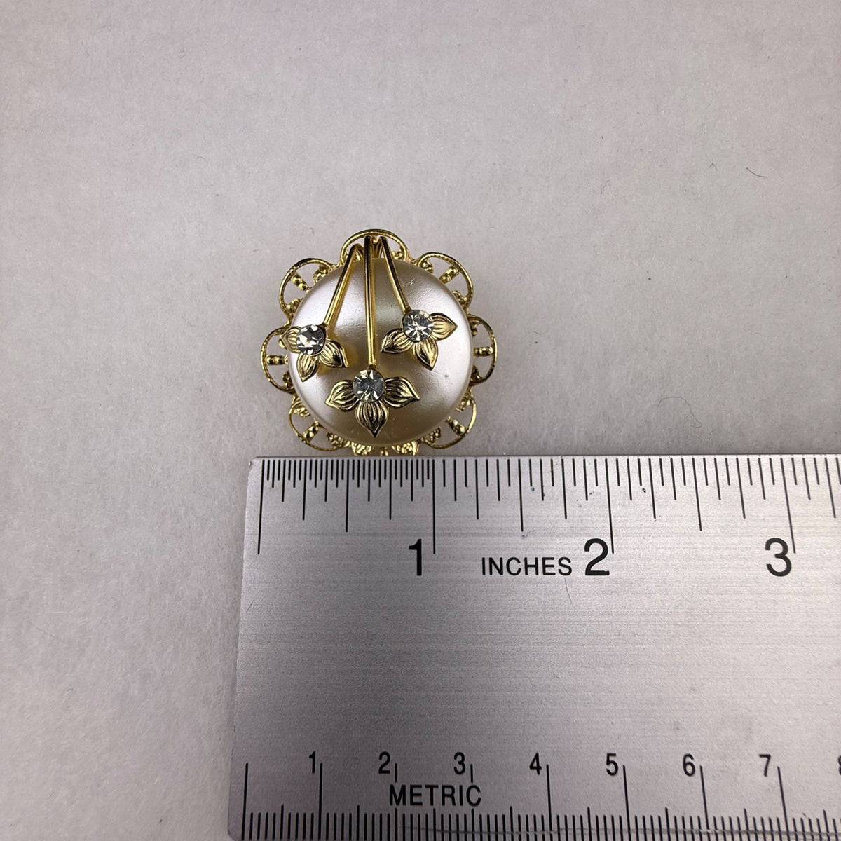 Vintage Gold Tone Flower Clip-On Earrings With Rhinestone Accents Round Filigree Design