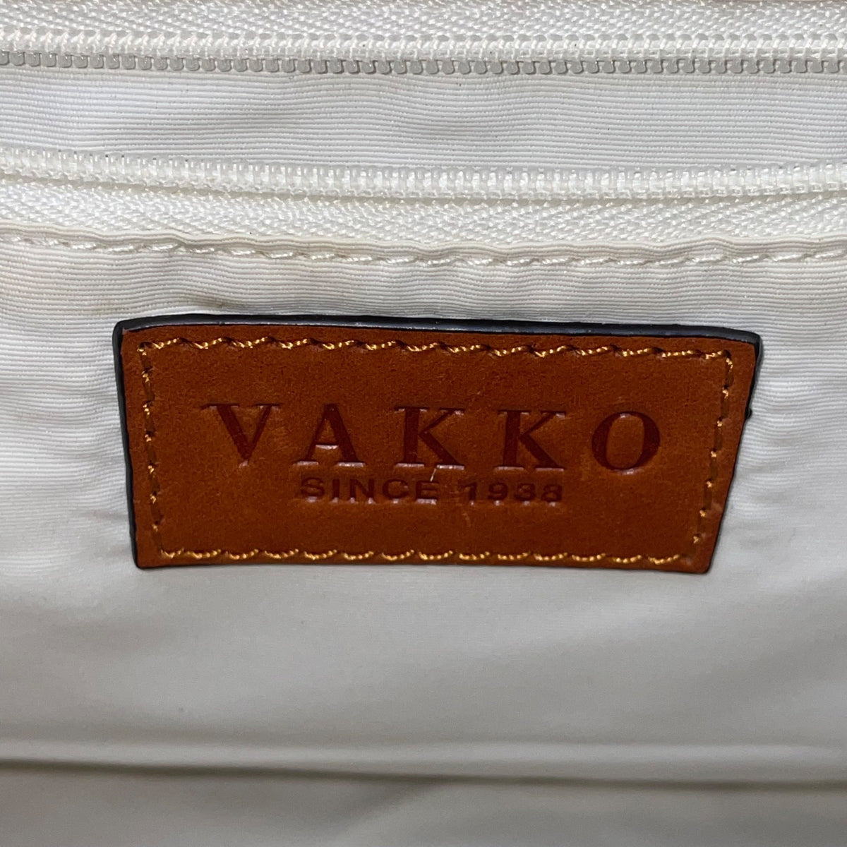 Vakko Women’s Beige/Brown Leather Monogram Tassel Adjustable Strap Crossbody Bag